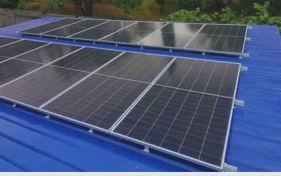 Solar panels on a blue metal roof at Alfonso Resort in Botolan, Zambales