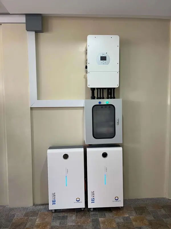 Hybrid inverter above a protection panel and two battery cabinets